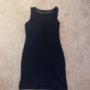 Black cocktail dress with sheer back panel